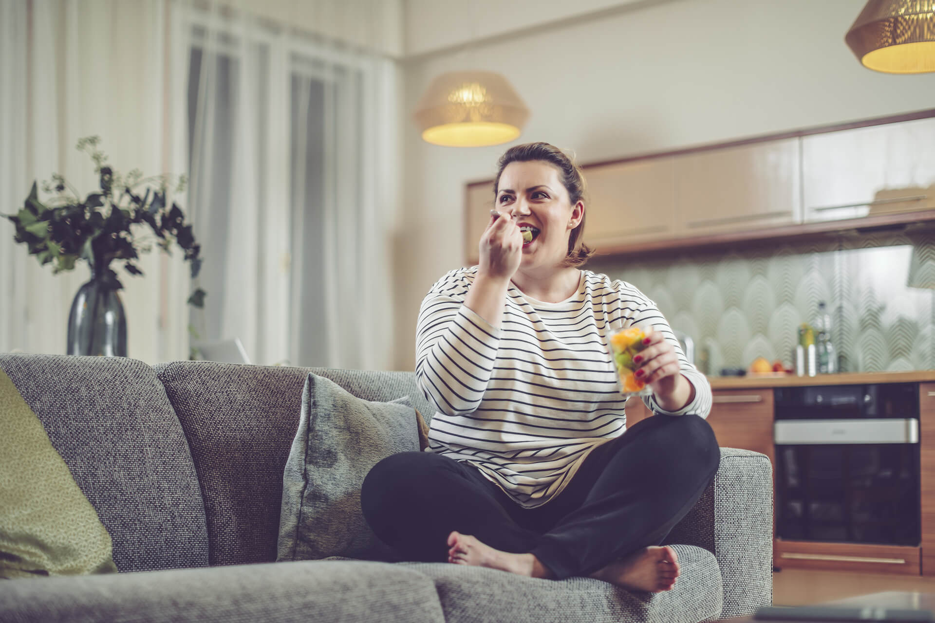 Woman eating fruit